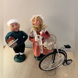 Byers Choice Carolers.  1998 boy.  2007 girl. Unicycle.